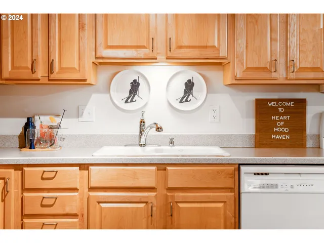 a kitchen with a sink and a stove