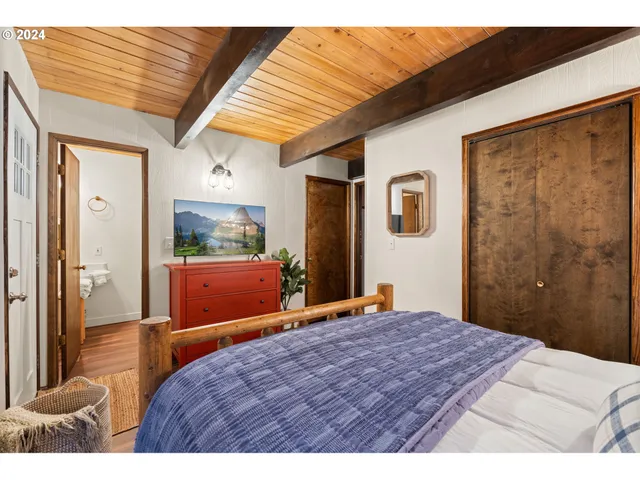 a bedroom with a bed and a dresser