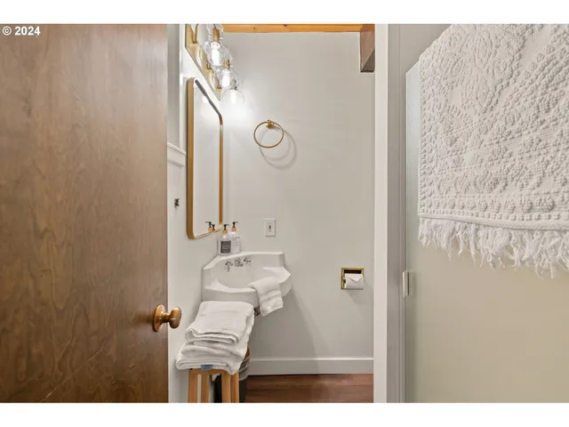 a white bath tub sitting next to a white sink