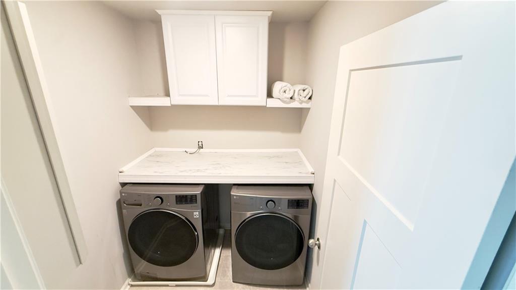 3370 Elkhorn Ridge Run Dacula, GA 30019 - Photo 13 of 29 a utility room with dryer and washer