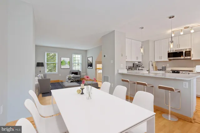 a kitchen with stainless steel appliances a sink stove and refrigerator