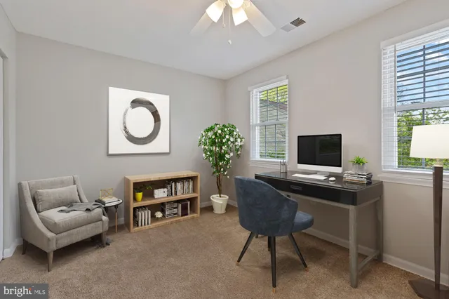 a view of an empty room with a fireplace