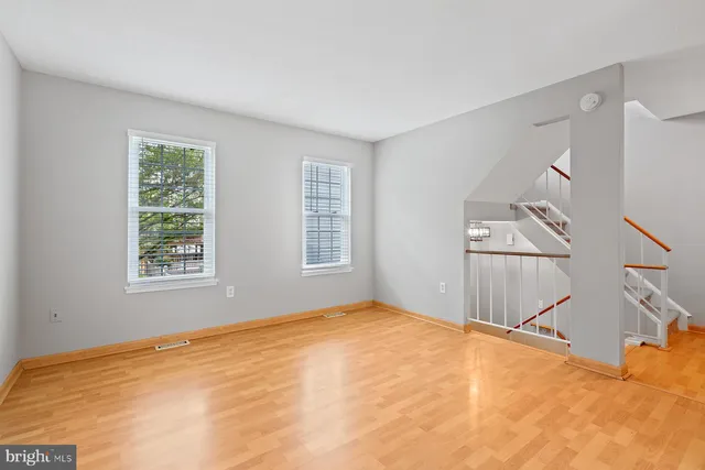 a view of a room with windows and entryway