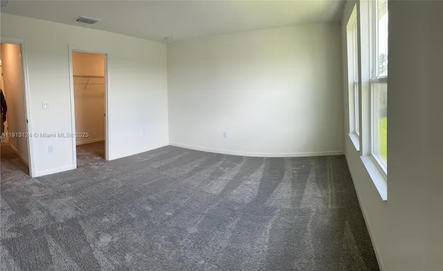 an empty room with a natural light