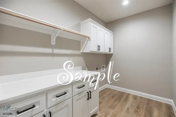 a view of storage and utility room with washer and dryer