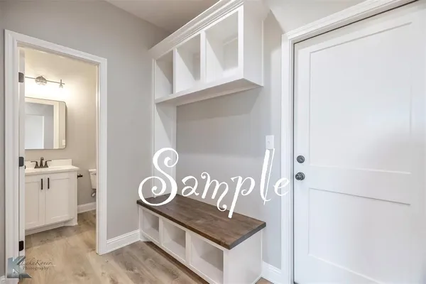 a view of an entryway with wooden floor