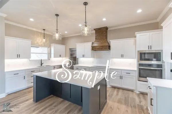 a kitchen with a sink stove and cabinets