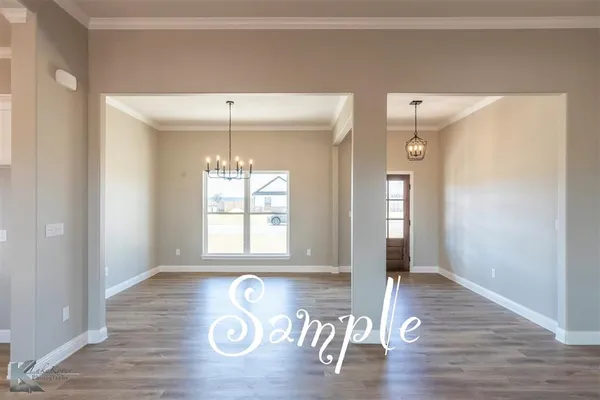 a view of a kitchen with a window wooden floor and a kitchen