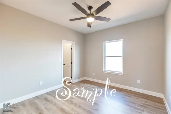a view of a livingroom with wooden floor