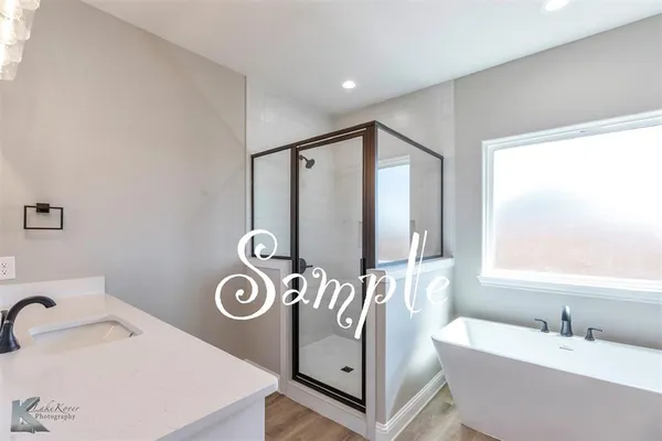 a bathroom with a bathtub and a sink