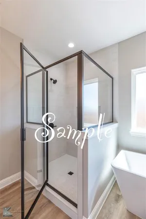 a bathroom with a bathtub and a sink