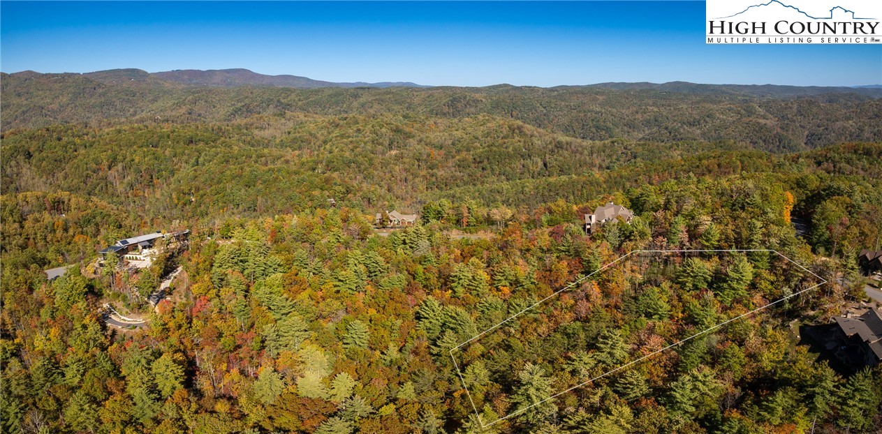 255 Red Cedar Road Boone, NC 28607 - Photo 4 of 49 a view of a lush green hillside and a mountain