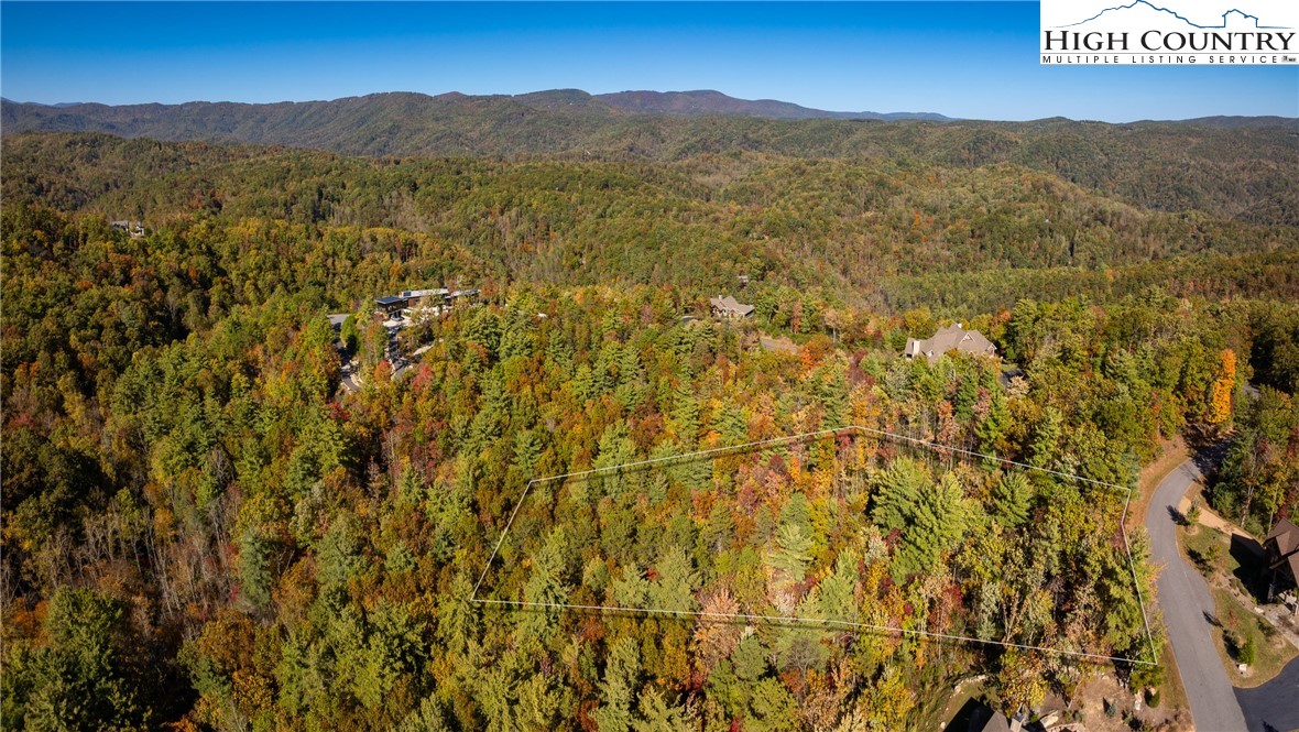 255 Red Cedar Road Boone, NC 28607 - Photo 5 of 49 a view of a field with a mountain in the background
