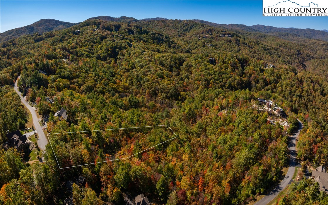 255 Red Cedar Road Boone, NC 28607 - Photo 7 of 49 a view of a field with a mountain in the background