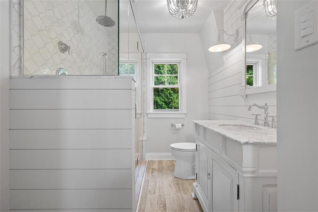 853 West Ingomar Road Pittsburgh, PA 15237 - Photo 28 of 50 The owners had a complete renovation of the 2nd floor full bathroom in 2018 with heated porcelin tile flooring, tiled in shower with built in bench seat. The white shiplap wall and rainfall shower head are just perfect selections for this bright bathroom.
