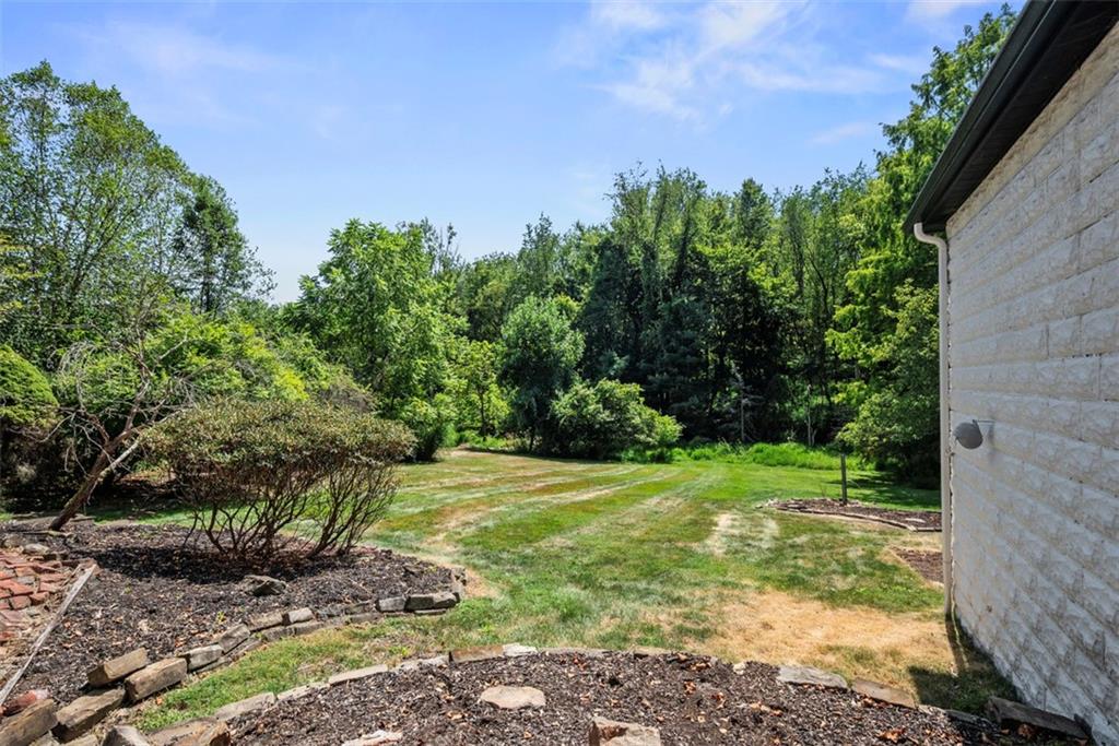 853 West Ingomar Road Pittsburgh, PA 15237 - Photo 3 of 50 Situated on a private .65 acre lot that is lined by trees and a wooded buffer behind you.