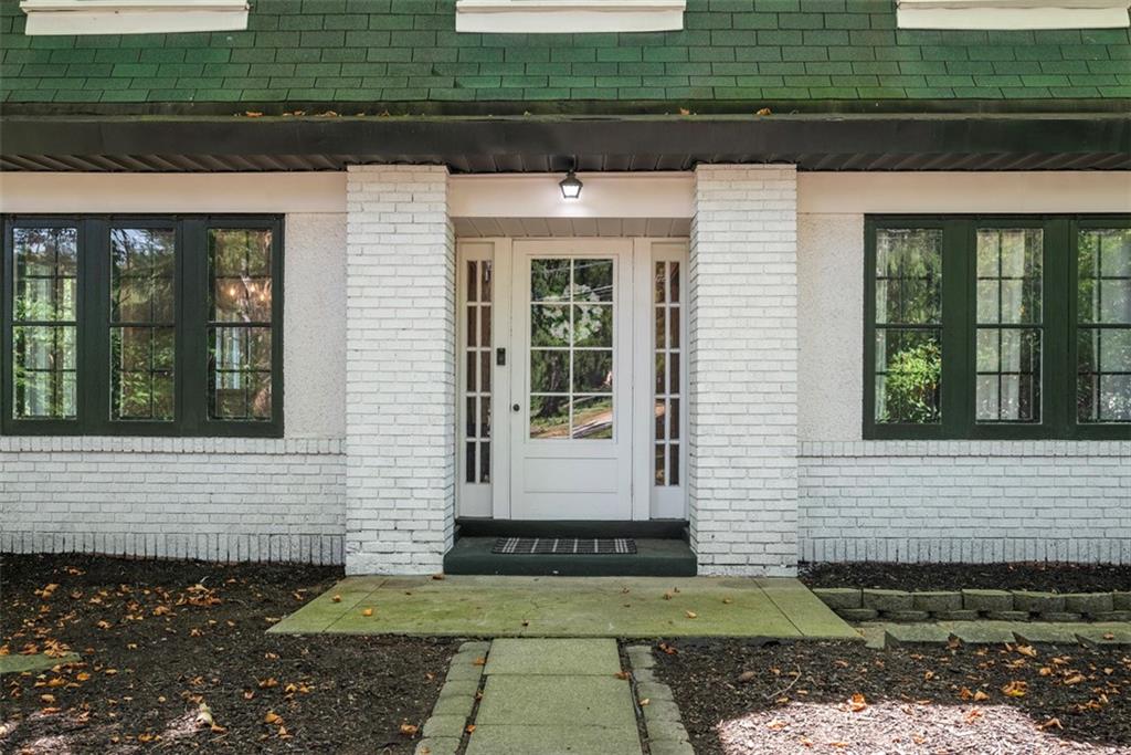 853 West Ingomar Road Pittsburgh, PA 15237 - Photo 38 of 50 The front door with sidelights makes an immediate impression and the white and green contrast theme is continued with the storm windows and painted brick.