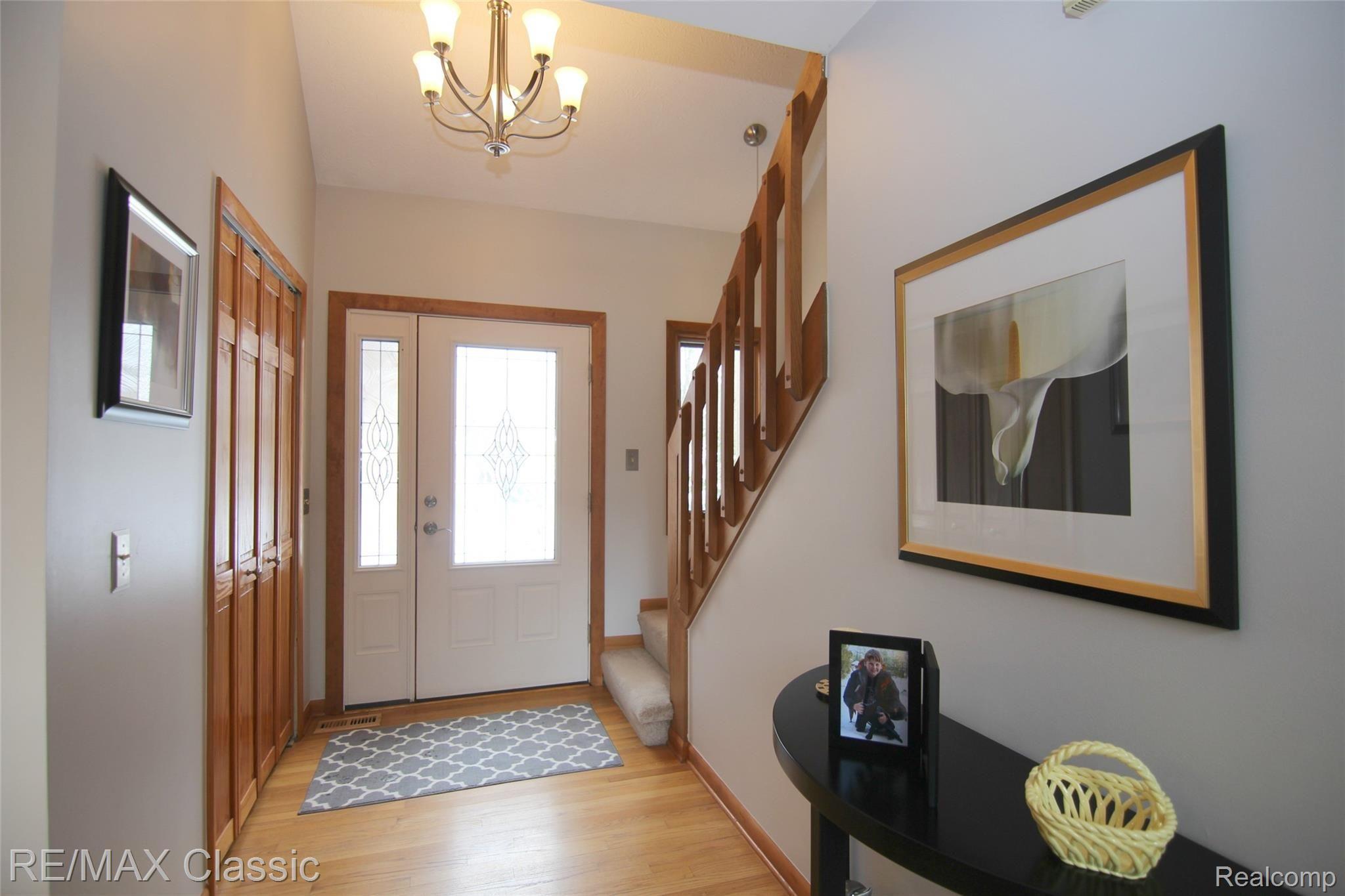 2059 Addaleen Road Highland, MI 48357 - Photo 2 of 33 jAddaleen Rd Foyer note wood flooring