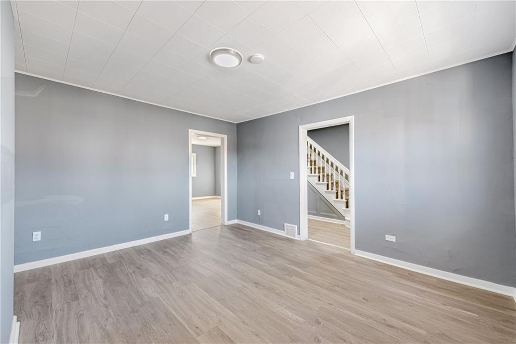 1222 Valley Street McKees Rocks, PA 15136 - Photo 4 of 13 a view of an empty room with wooden floor and entryway