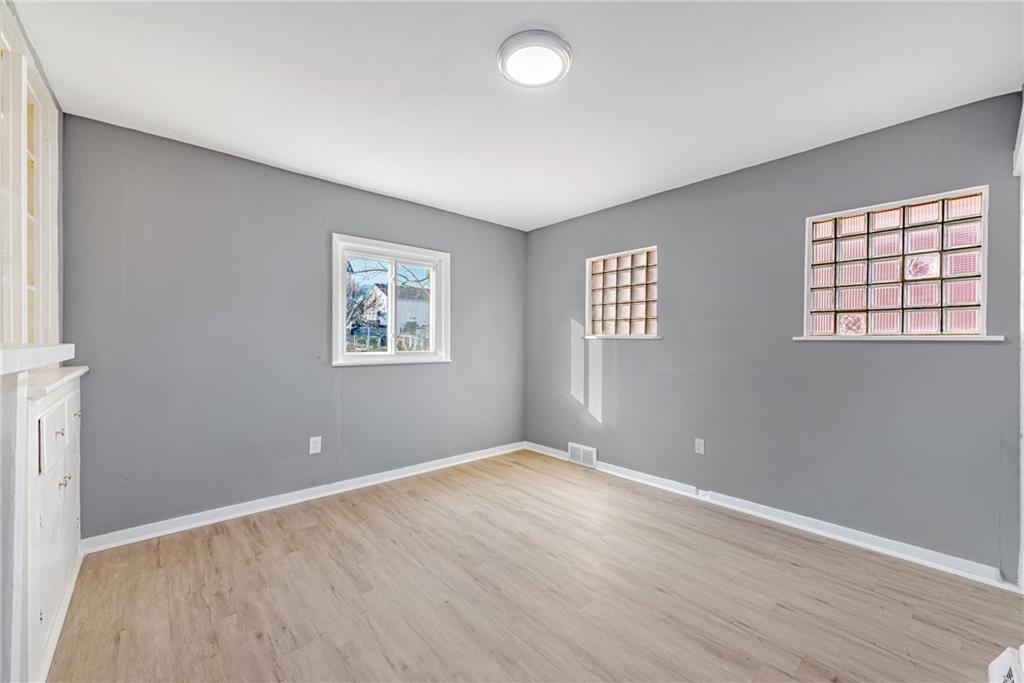 1222 Valley Street McKees Rocks, PA 15136 - Photo 6 of 13 an empty room with windows and closet