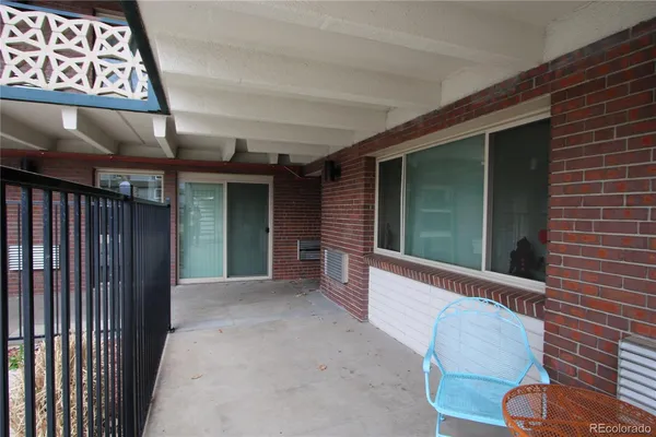 a view of a brick wall and a window