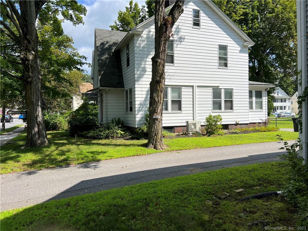 856 Main Street Torrington, CT 06790 - Photo 1 of 1 a view of a house with a yard and plants