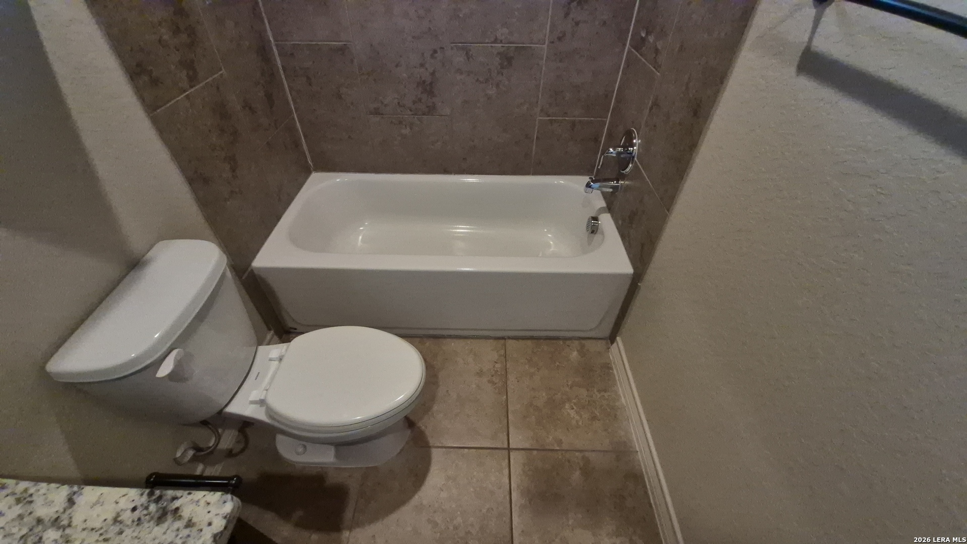 6414 Luglio Lane, Unit 101 San Antonio, TX 78233 - Photo 15 of 23 a bathroom with a toilet and a sink