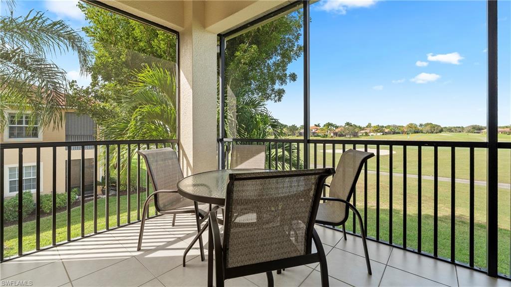 8617 Champions Point, Unit 403 Naples, FL 34113 - Photo 2 of 37 Enjoy breakfast and/or dinner over the luscious greens of The Lely Mustang Course