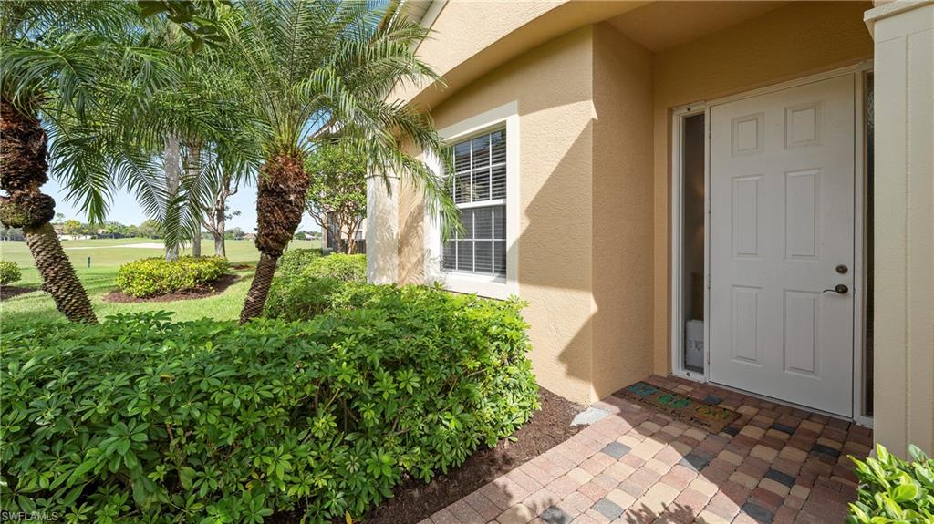 8617 Champions Point, Unit 403 Naples, FL 34113 - Photo 36 of 37 Property entrance featuring stucco siding