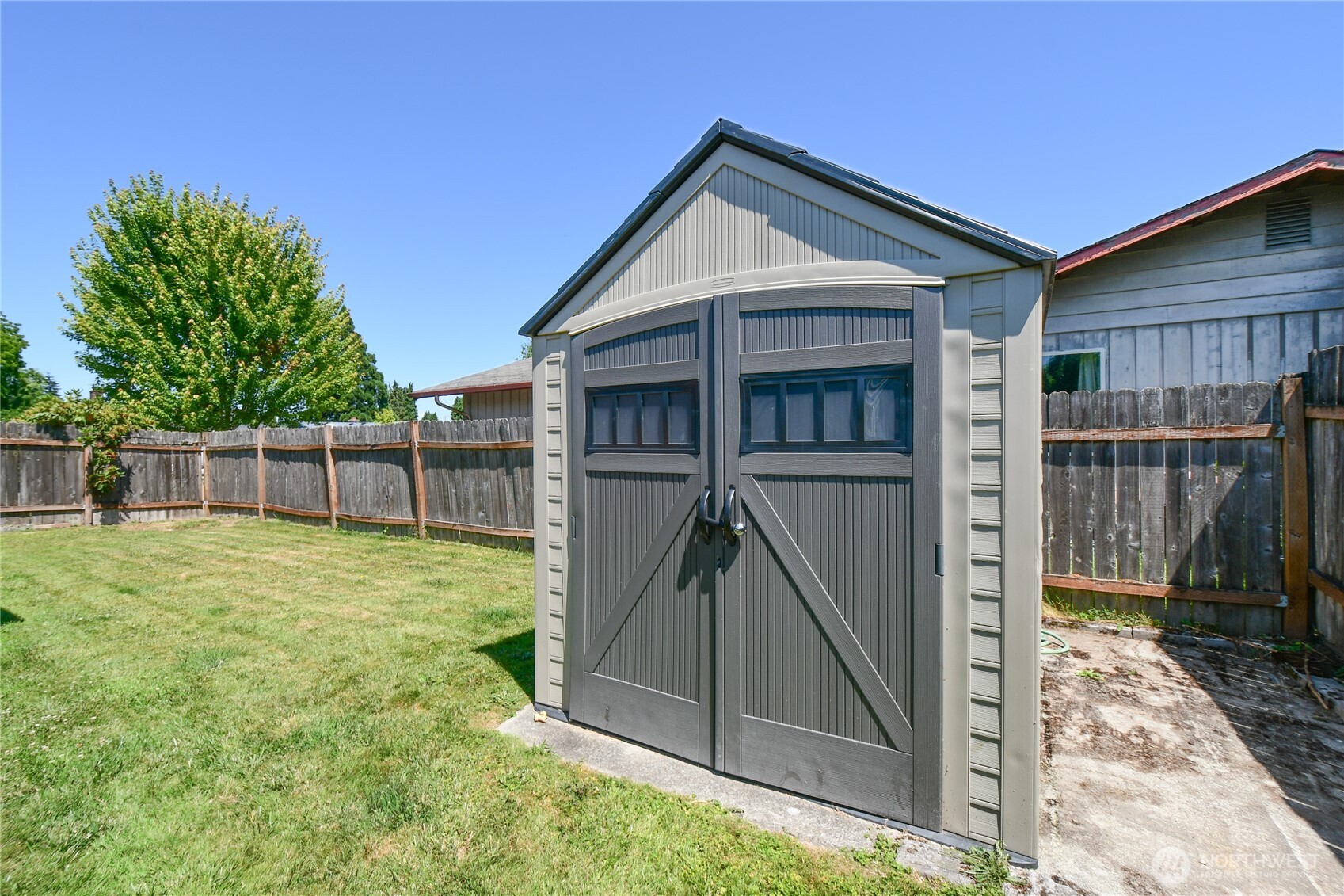 2102 35th Avenue Longview, WA 98632 - Photo 27 of 31 a view of a small house with wooden fence