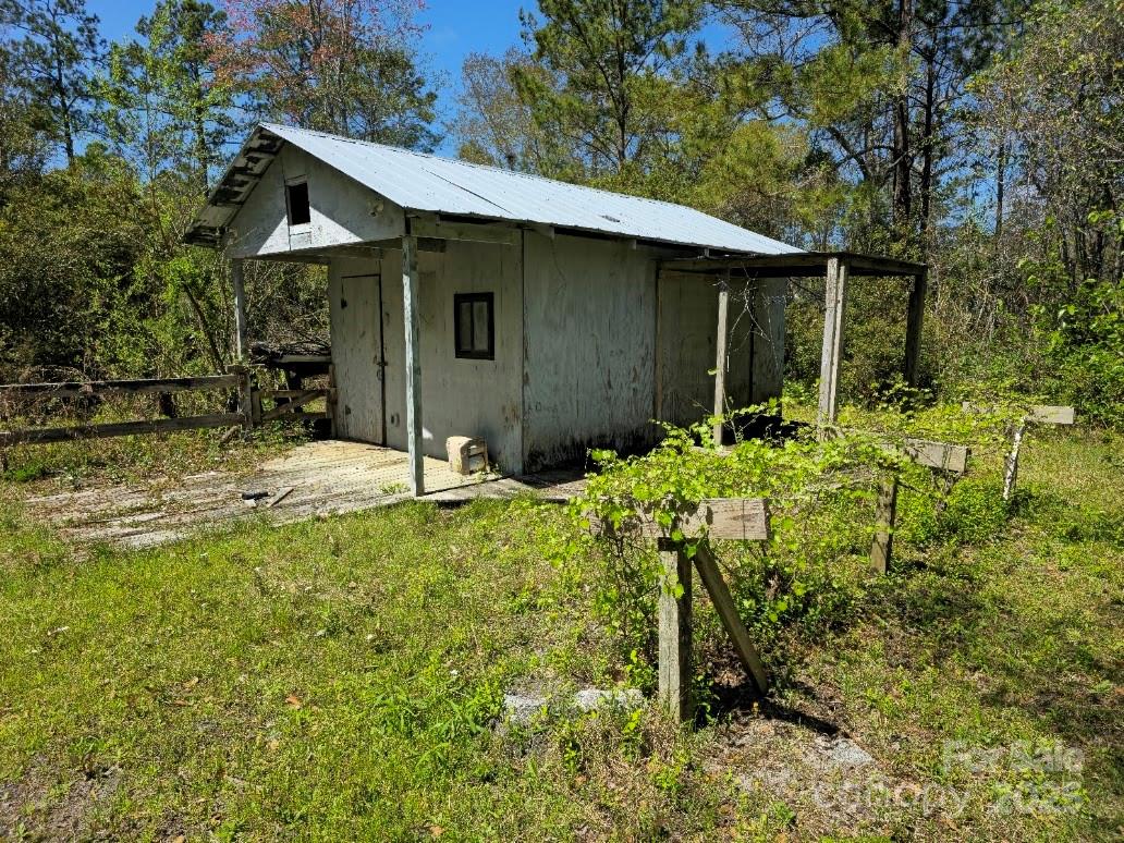 2169 Stone Chimney Road Southwest Supply, NC 28462 - Photo 11 of 27 a backyard of a house with yard and tree