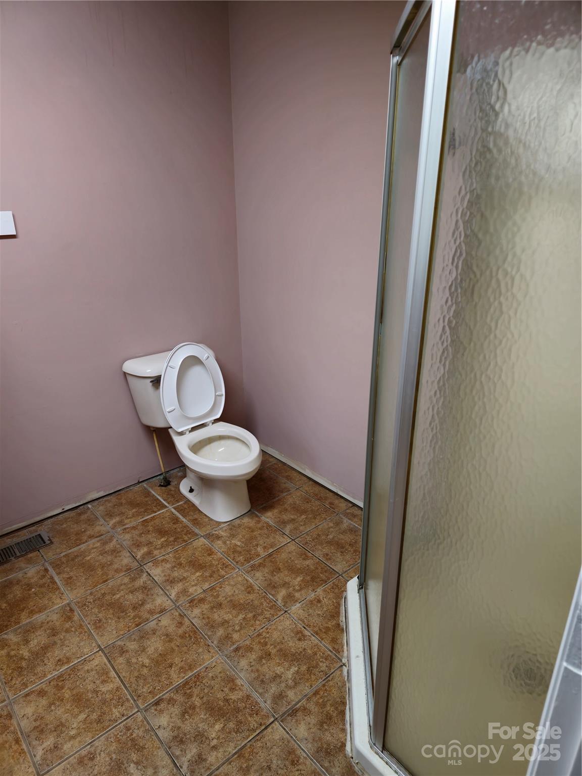 2169 Stone Chimney Road Southwest Supply, NC 28462 - Photo 13 of 27 a white toilet sitting next to a shower