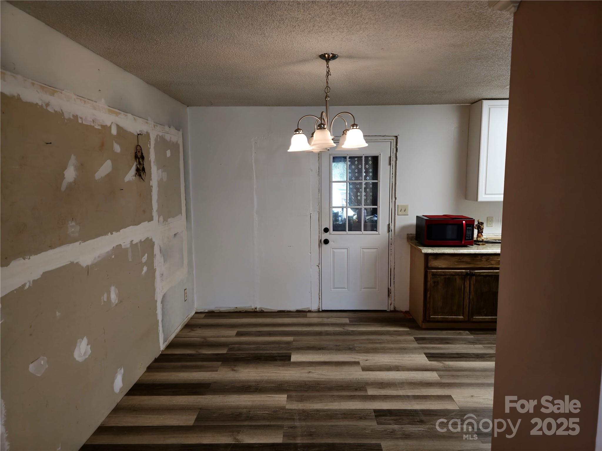 2169 Stone Chimney Road Southwest Supply, NC 28462 - Photo 14 of 27 a view of a hallway view with wooden floor and staircase