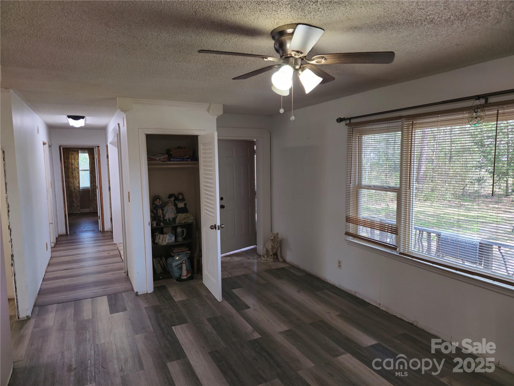 2169 Stone Chimney Road Southwest Supply, NC 28462 - Photo 19 of 27 wooden floor in an empty room with a window