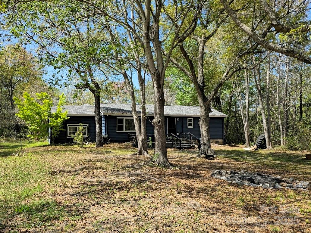 2169 Stone Chimney Road Southwest Supply, NC 28462 - Photo 2 of 27 a house with trees in the background