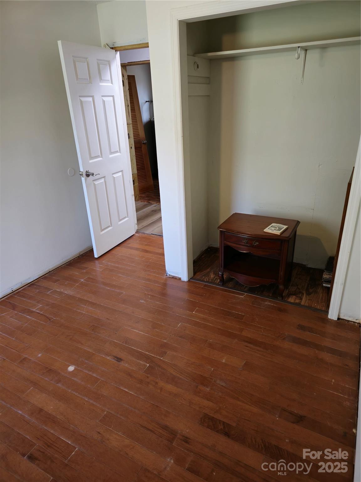 2169 Stone Chimney Road Southwest Supply, NC 28462 - Photo 25 of 27 a view of room with furniture and wooden floor