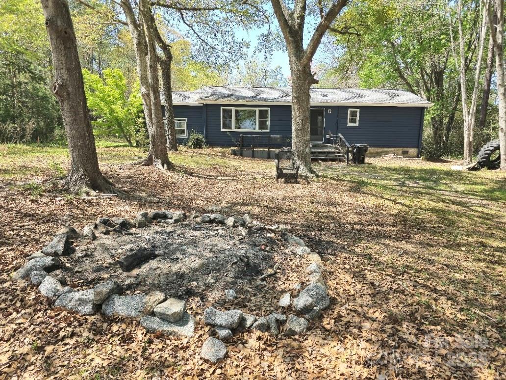 2169 Stone Chimney Road Southwest Supply, NC 28462 - Photo 3 of 27 a front view of house with yard and trees around