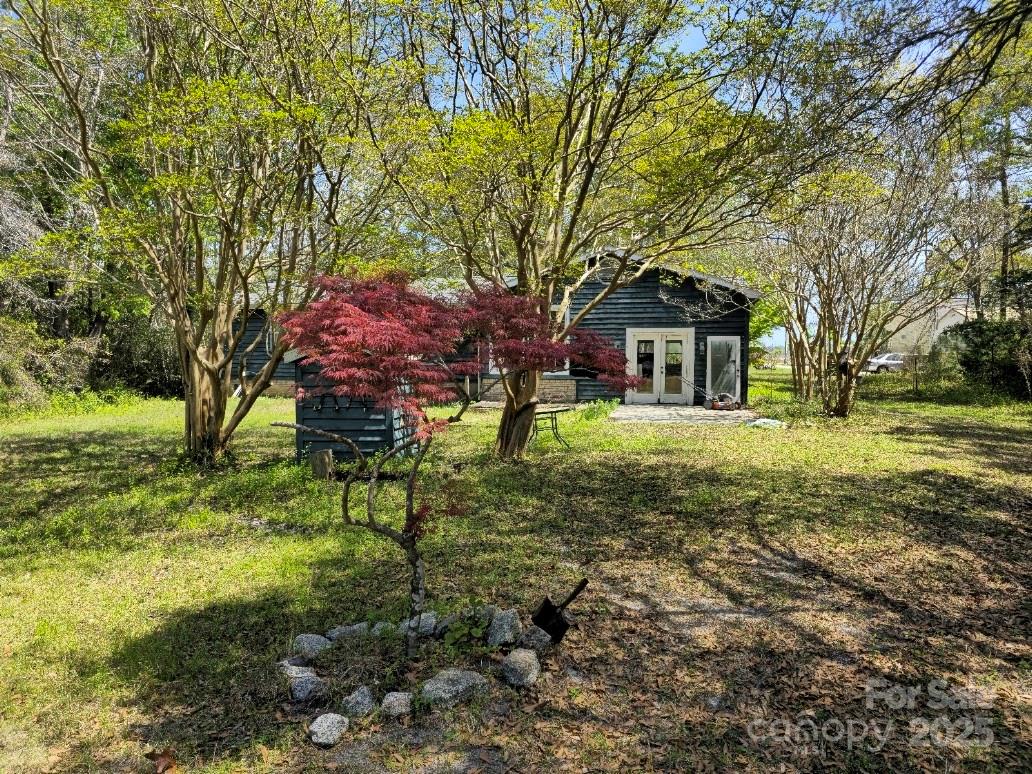 2169 Stone Chimney Road Southwest Supply, NC 28462 - Photo 6 of 27 a front view of a house with a yard