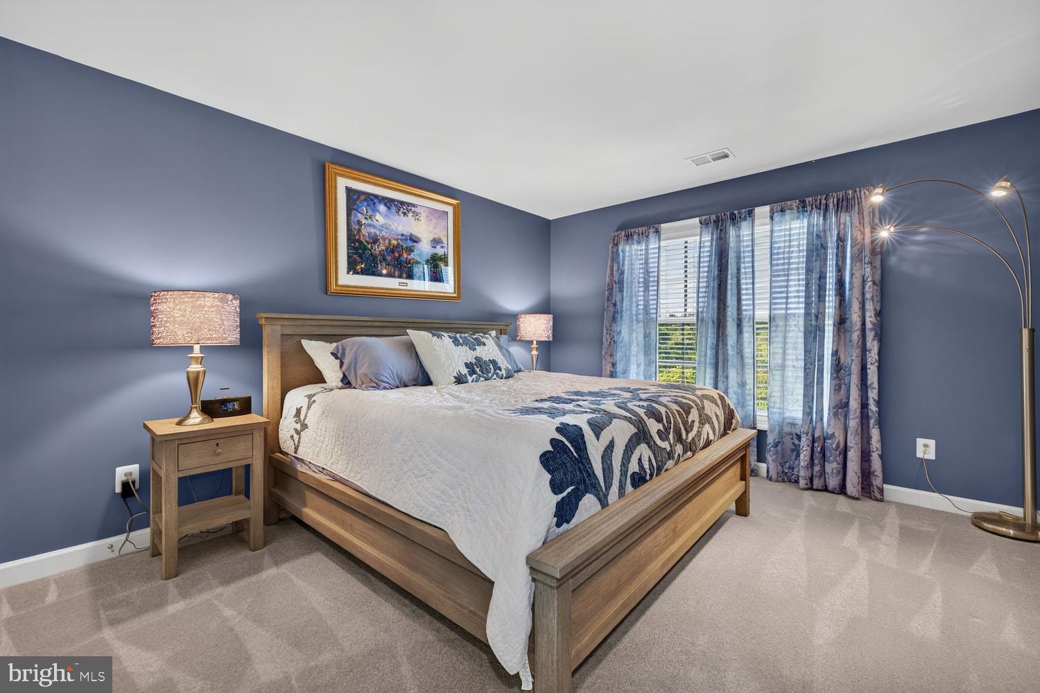 23106 Birch Mead Road Clarksburg, MD 20871 - Photo 26 of 60 a spacious bedroom with a bed and a lamp