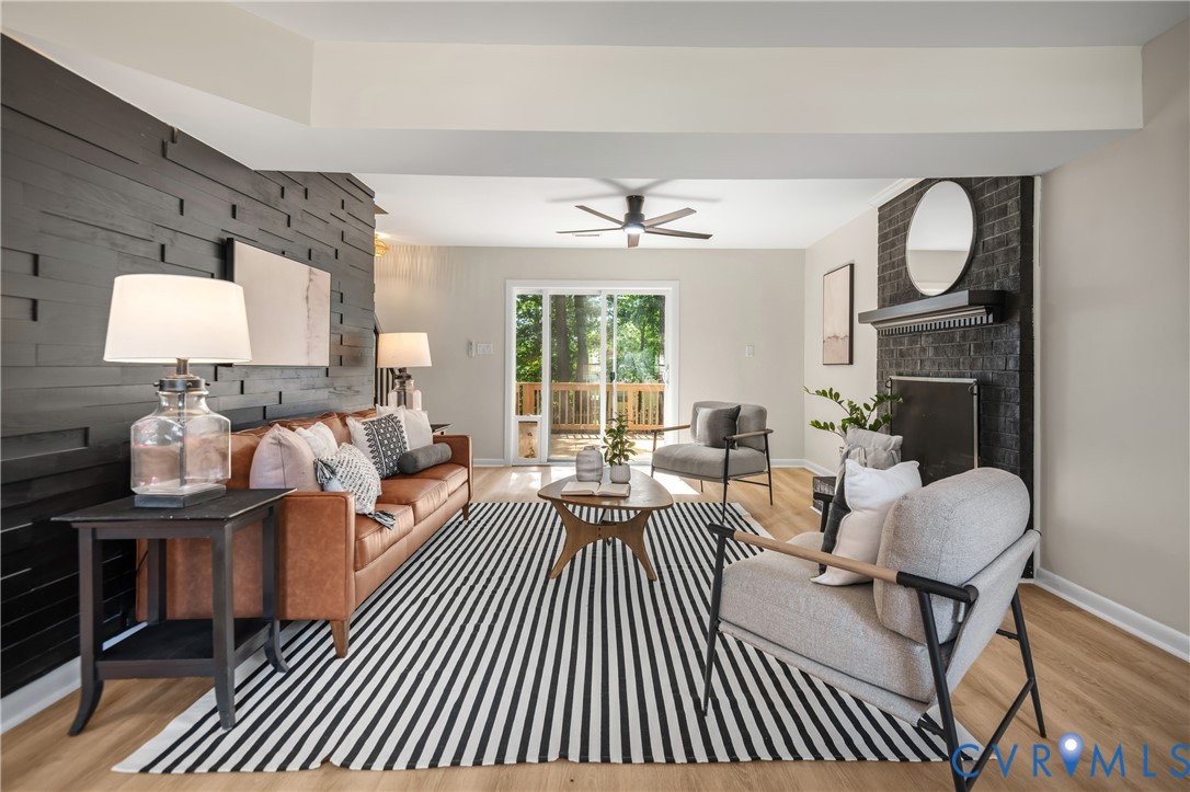 Light-toned wood-finish flooring, accent wall with