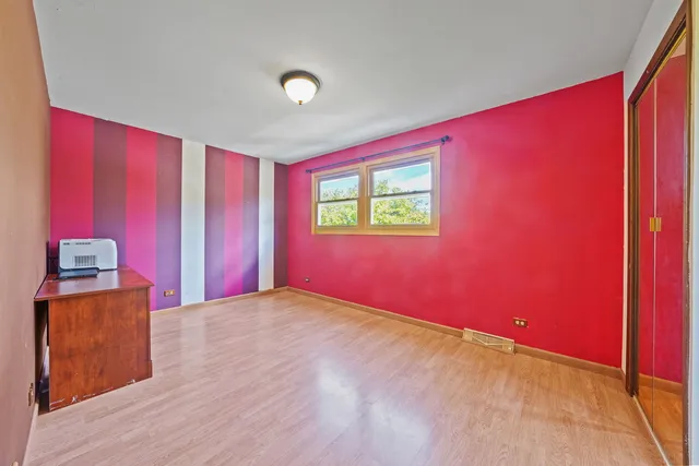 a view of a livingroom with an empty room and a window