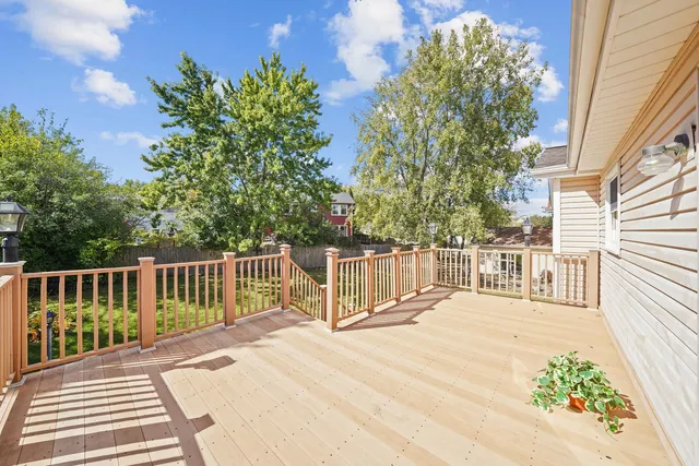 a view of a balcony with wooden floor