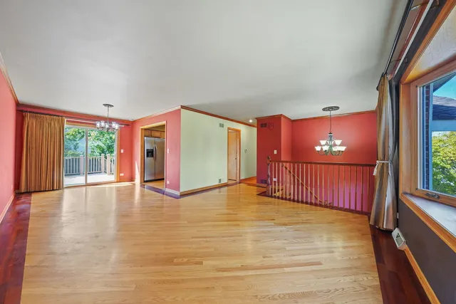 a view of livingroom with floor to ceiling windows and wooden floor