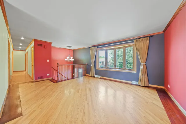 a view of an empty room with glass door