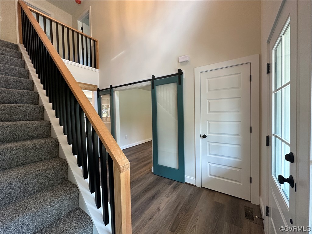 12037 Corte Castle Road Chesterfield, VA 23838 - Photo 5 of 48 a view of an entryway with wooden floor and stairs