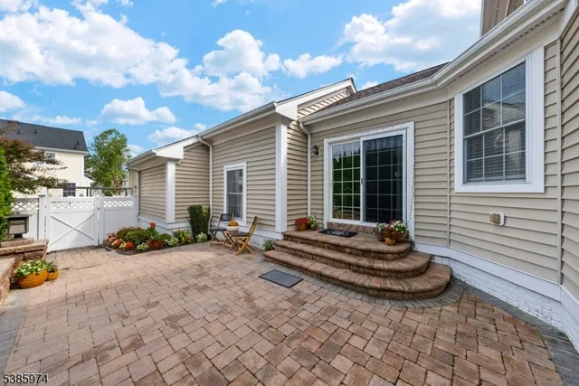 a blue bench sitting in front of a house