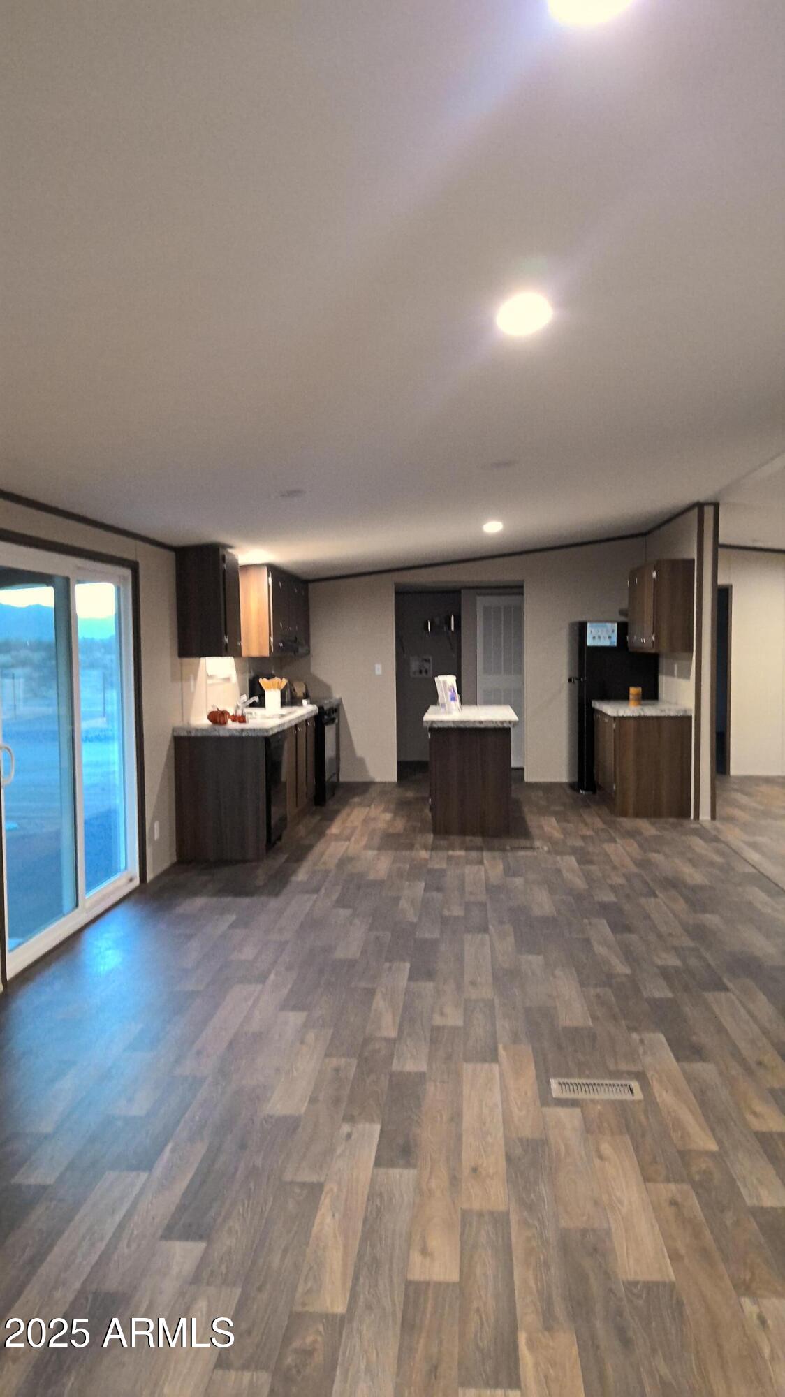 51603 West Pony Road Maricopa, AZ 85139 - Photo 24 of 36 a room with furniture and flat screen tv