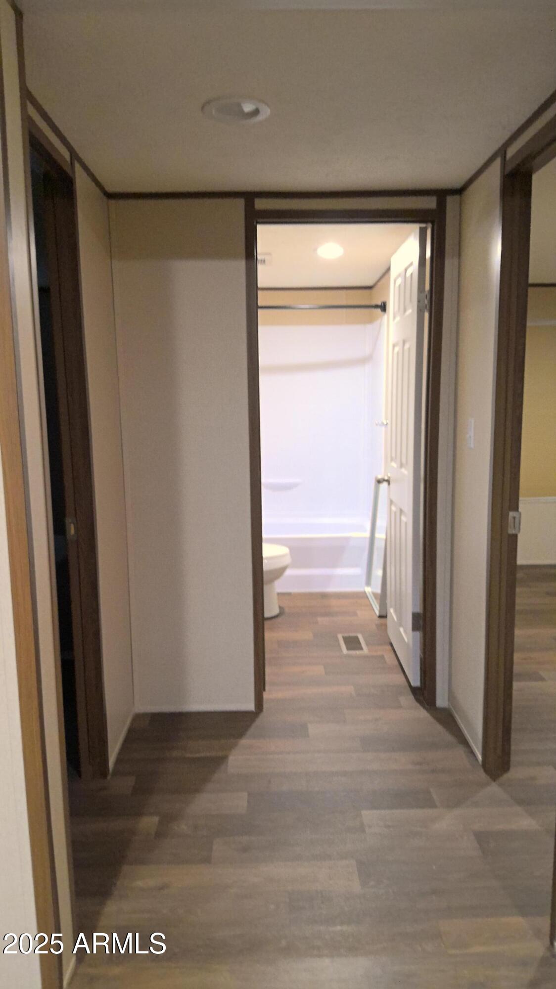 51603 West Pony Road Maricopa, AZ 85139 - Photo 31 of 36 a view of a big room with wooden floor and cabinet