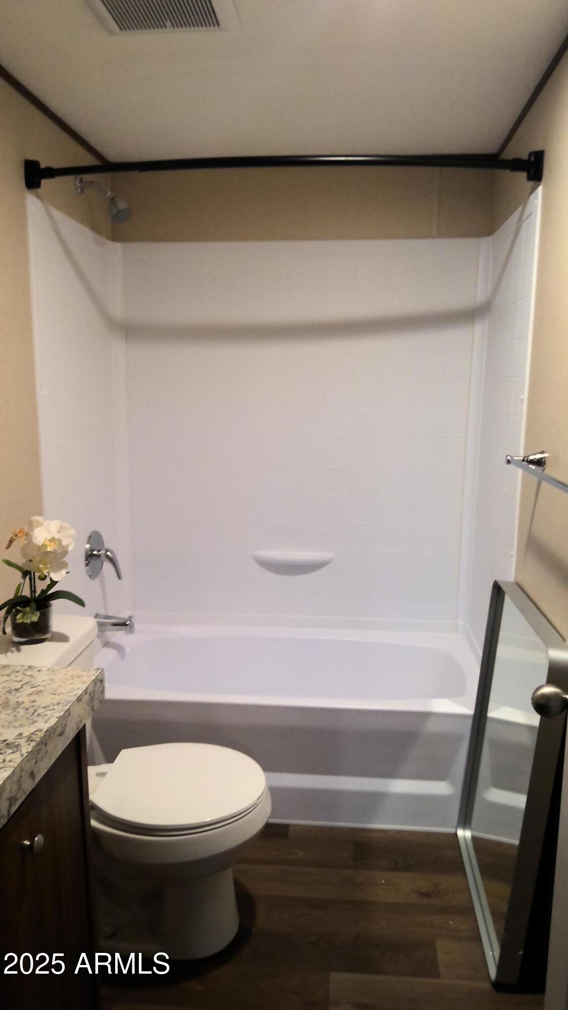 51603 West Pony Road Maricopa, AZ 85139 - Photo 36 of 36 a bathroom with a toilet and a shower