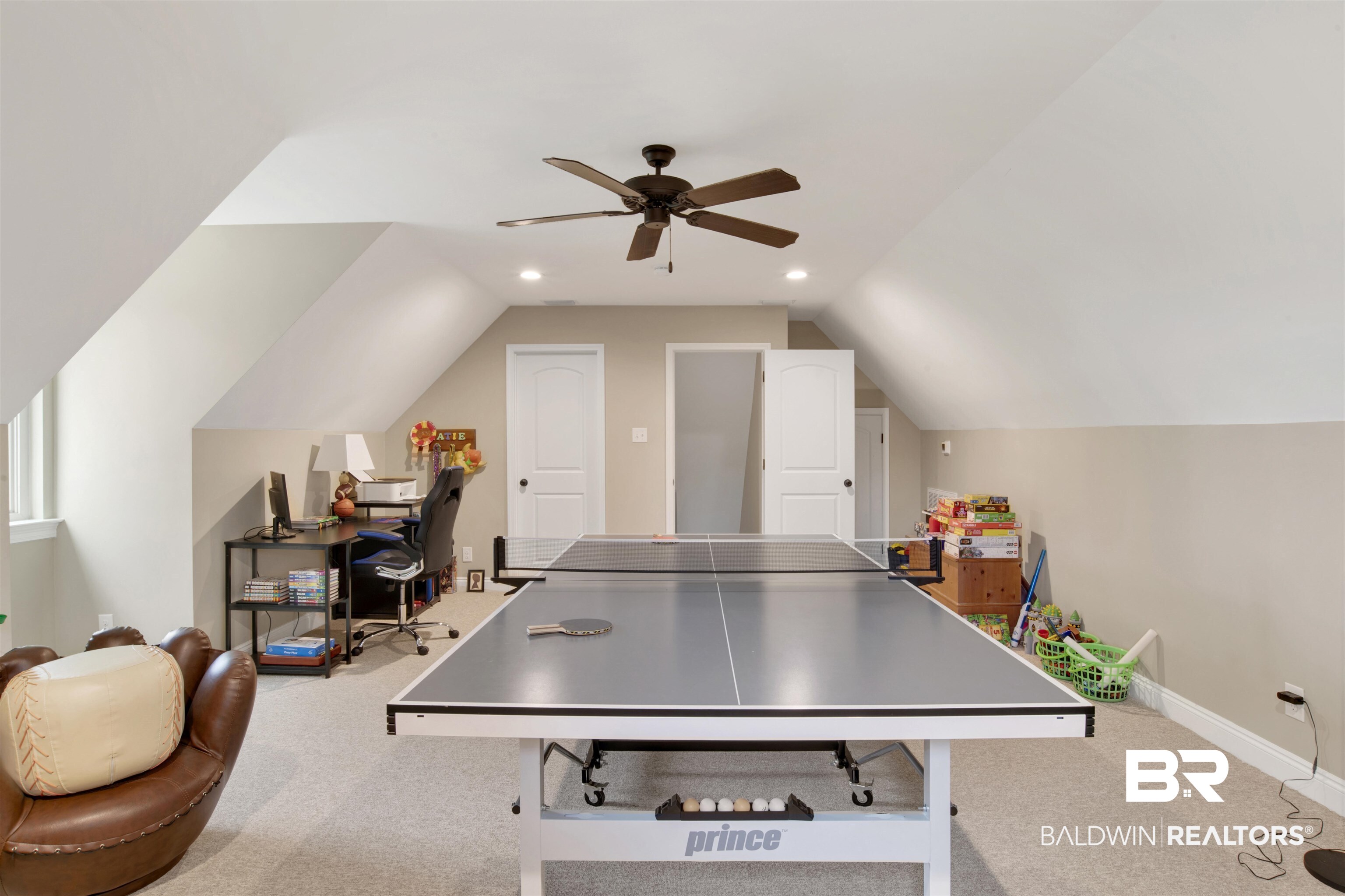 2440 Johnson Road West Mobile, AL 36695 - Photo 34 of 40 Recreation room with light colored carpet, vaulted ceiling, and ceiling fan